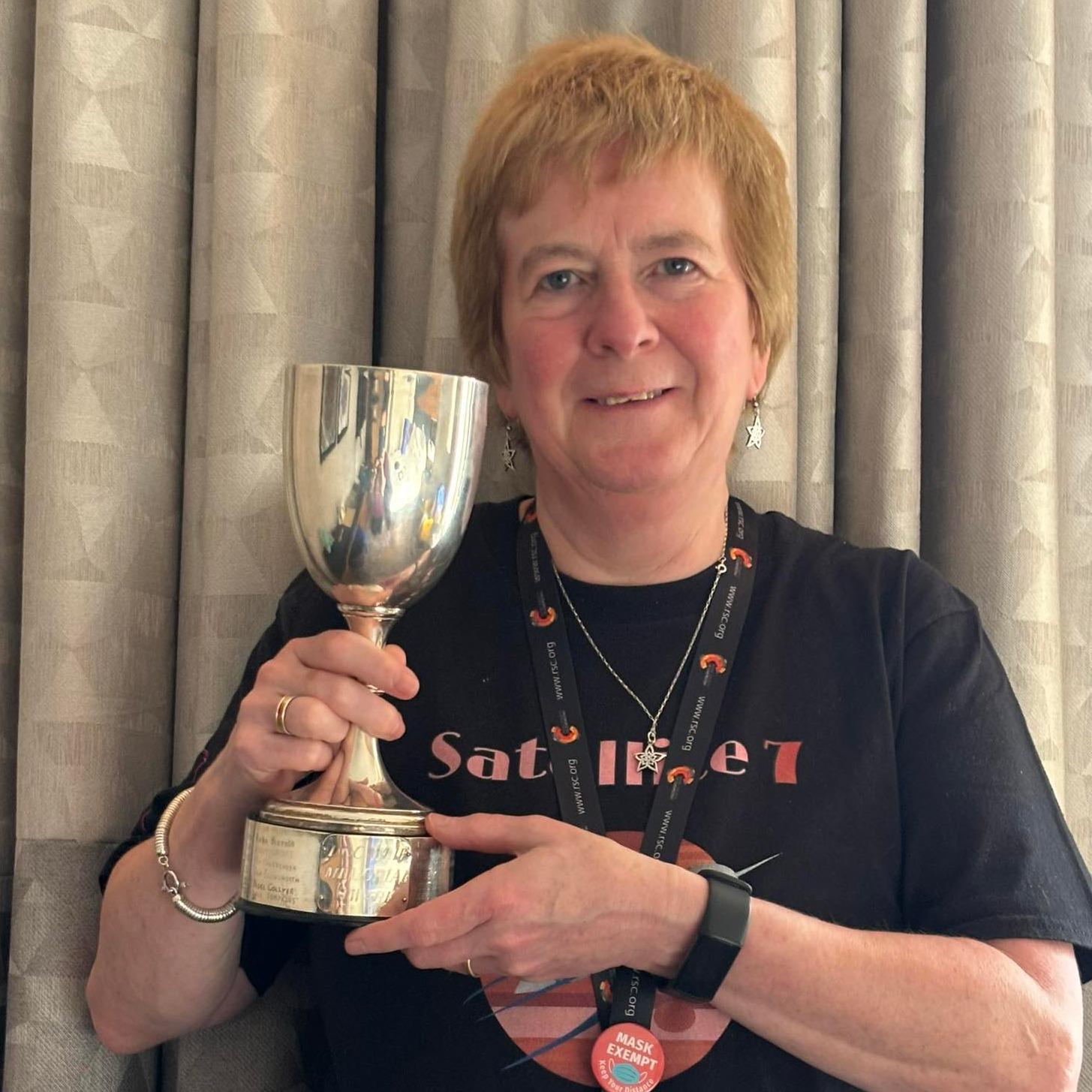 Christine Davidson holding the Doc Weir trophy
