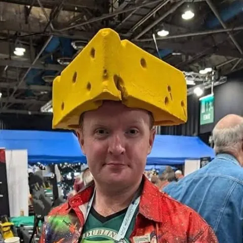 John in a cheese hat