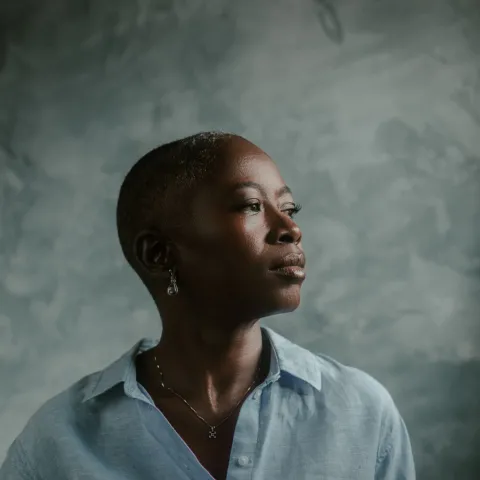 The author looking to the right, against a grey background