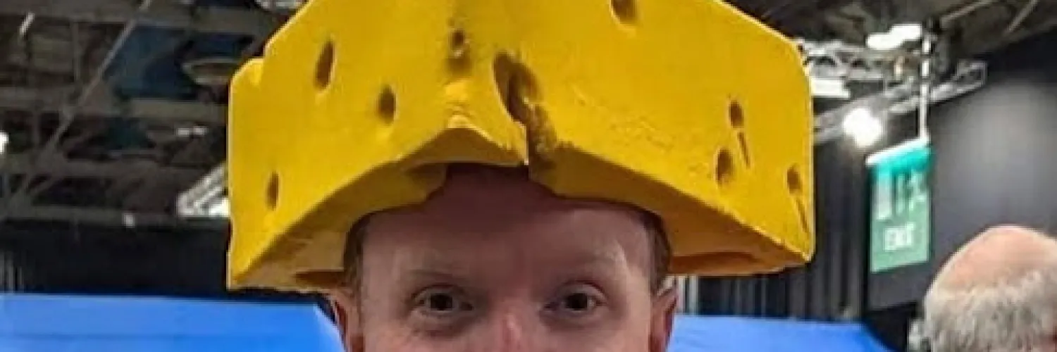 John in a cheese hat